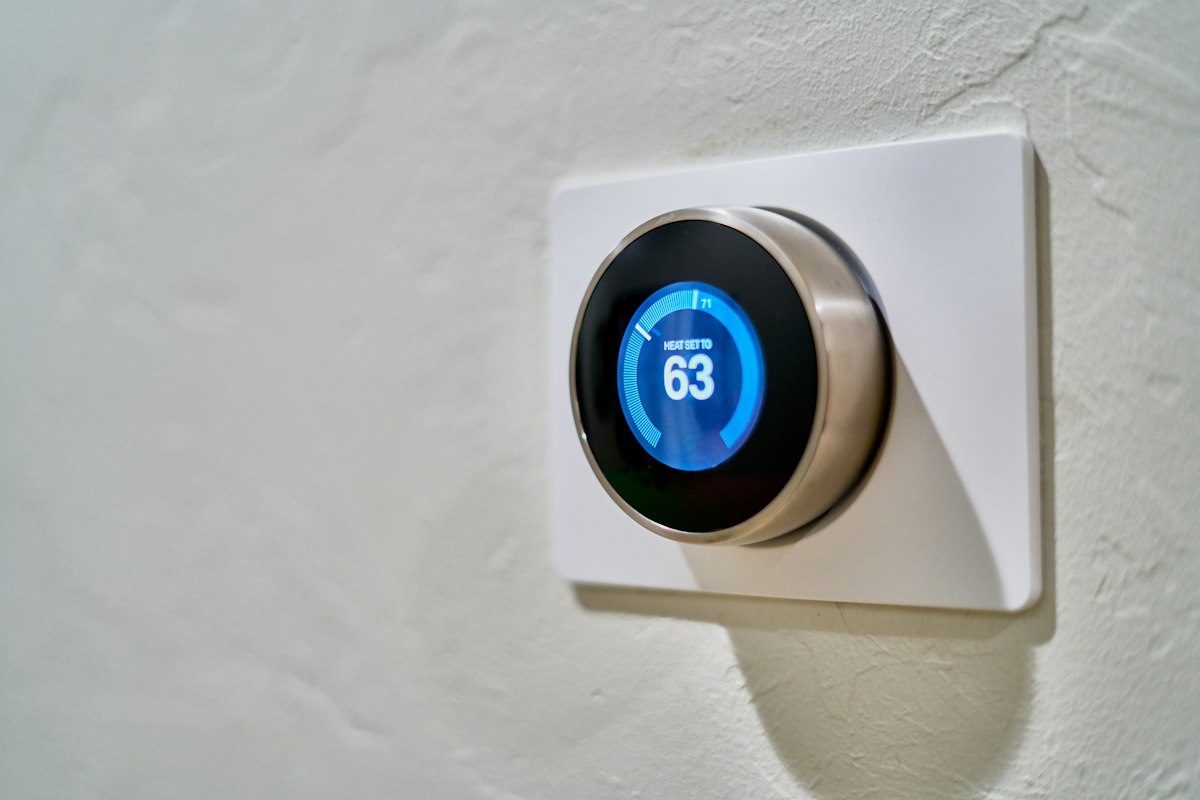 Modern thermostat on the wall